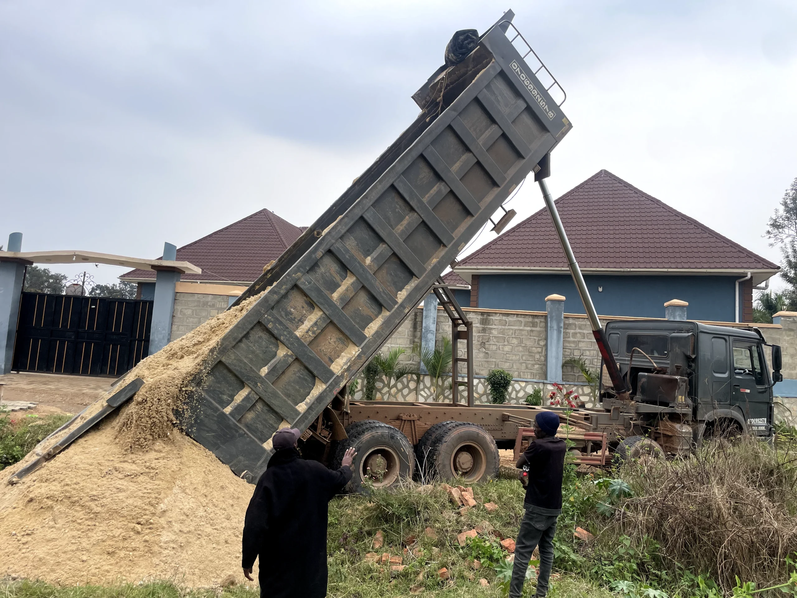 NestCraft team inspecting delivered cement and steel on site
